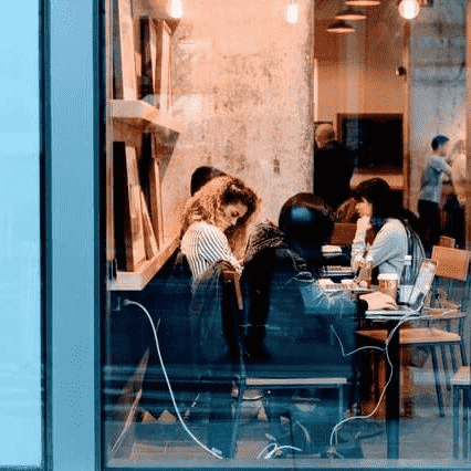 a group of people sitting at a table