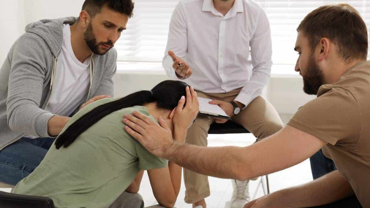 a group of people sitting in a circle